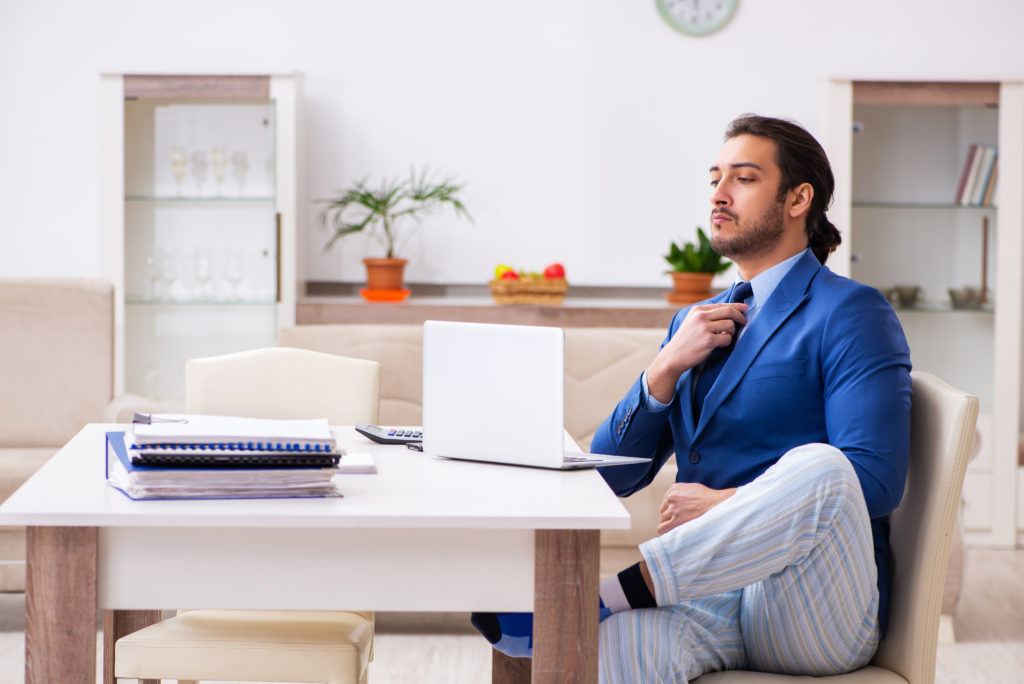 Man working from home in pajamas